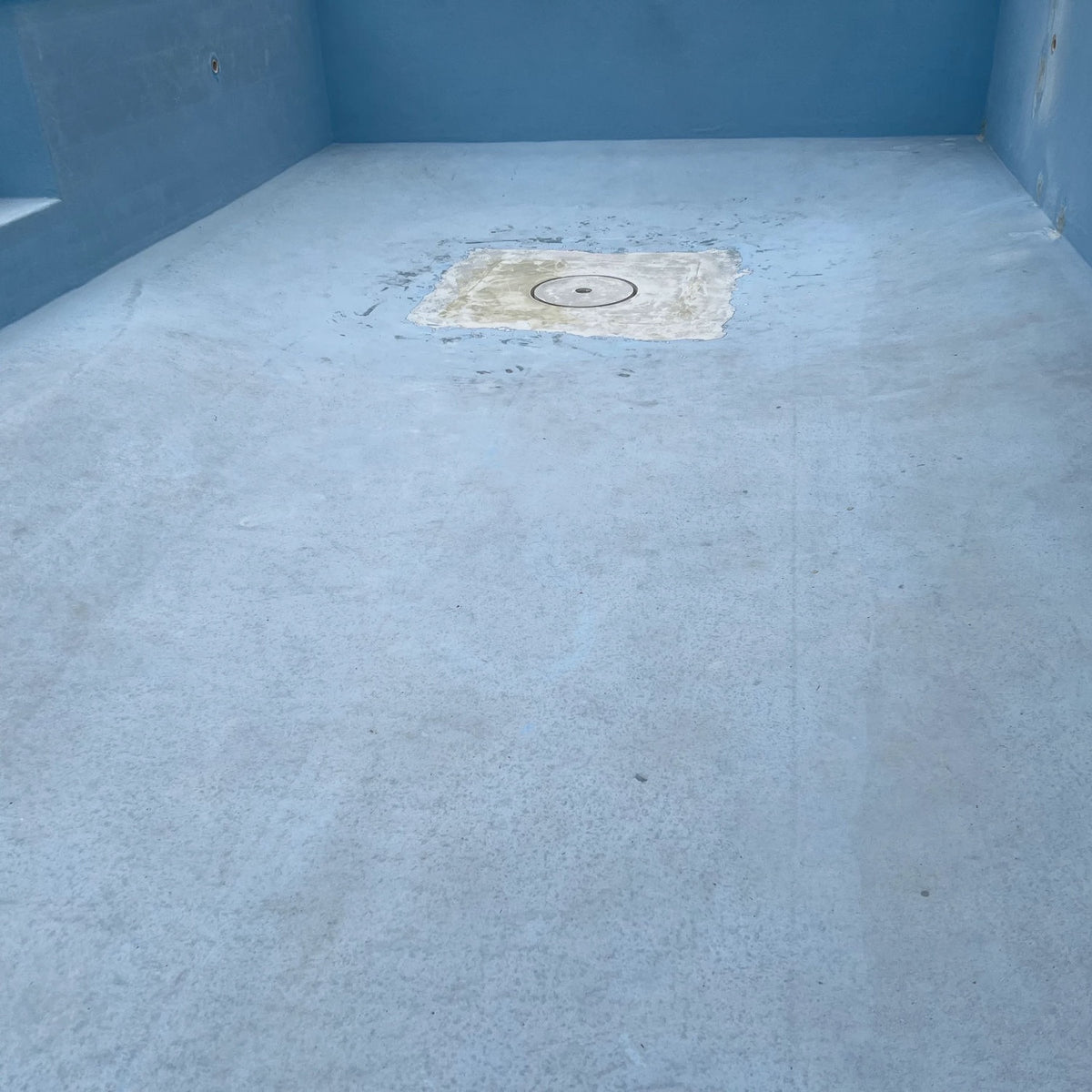 Before: worn pool interior prepped for recoating